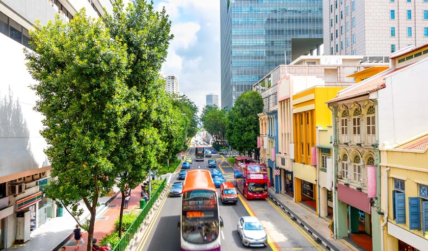 Elevated view of traffic on Singapore city street with modern colorful architecture