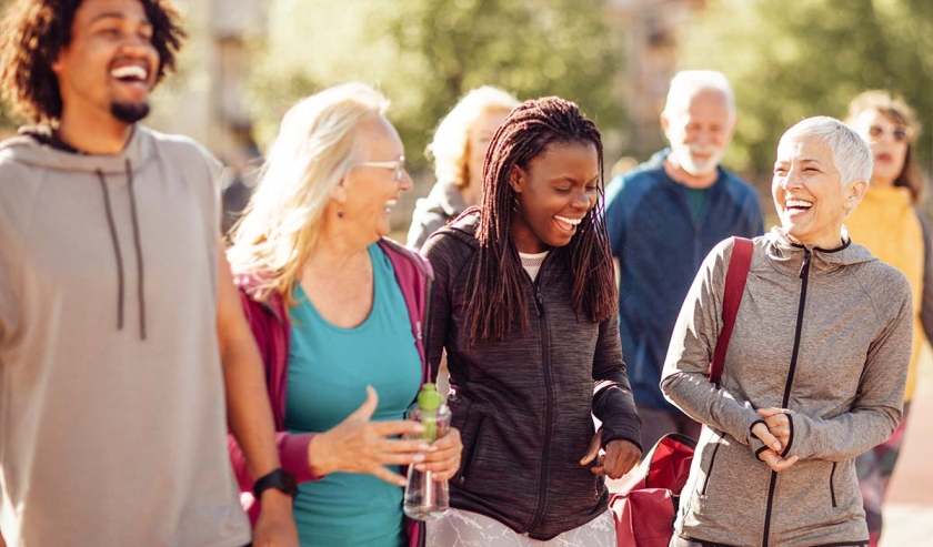 Smiling group of people walking together outdoors