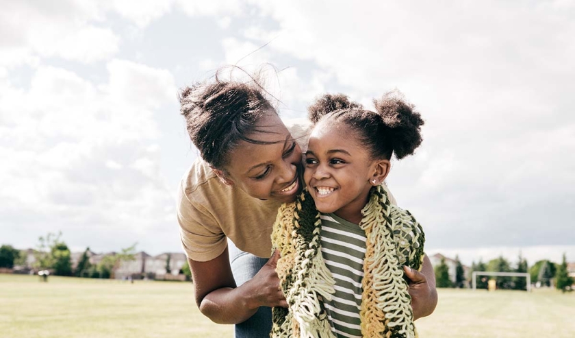 Mom and little daughter outdoors