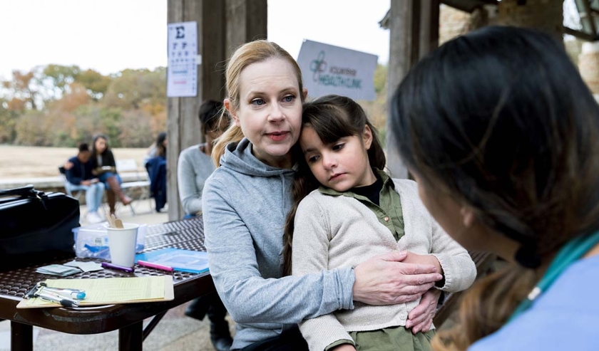 Parent and child talking with professional