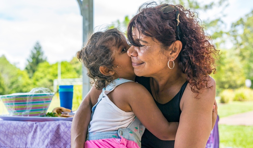 Australian Aboriginal Woman Hugging Her Grandaughter