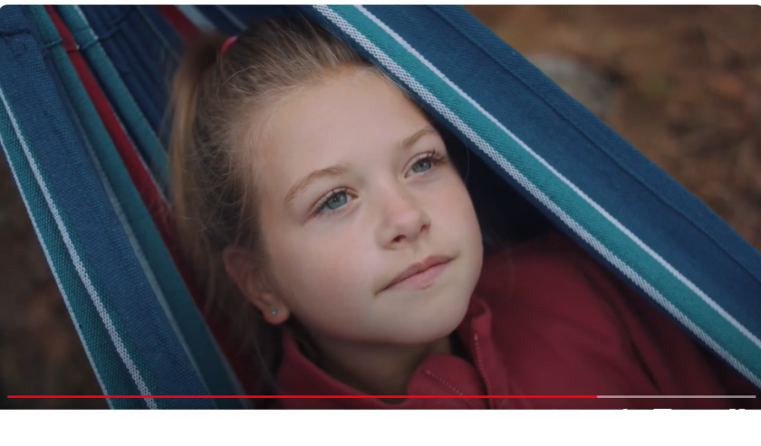 Still of girl in hammock from Kids First video