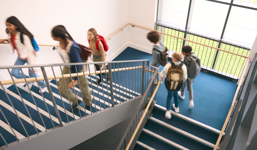 Secondary school students going up stairs