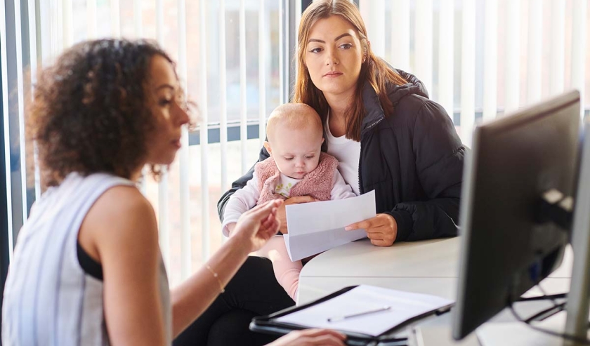 Woman with baby at consultation with care professional
