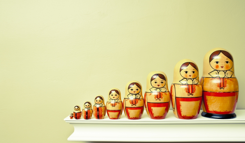 Russian dolls in an ascending line, representing the idea of scaling