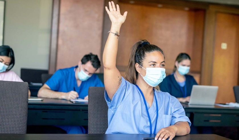 Medical staff seated in teaching room