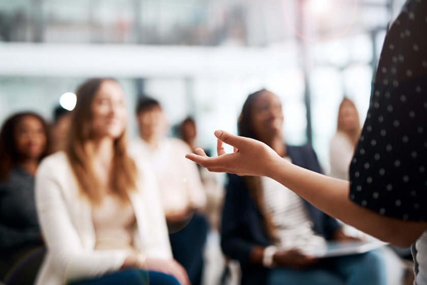 Speaker presenting at a conference