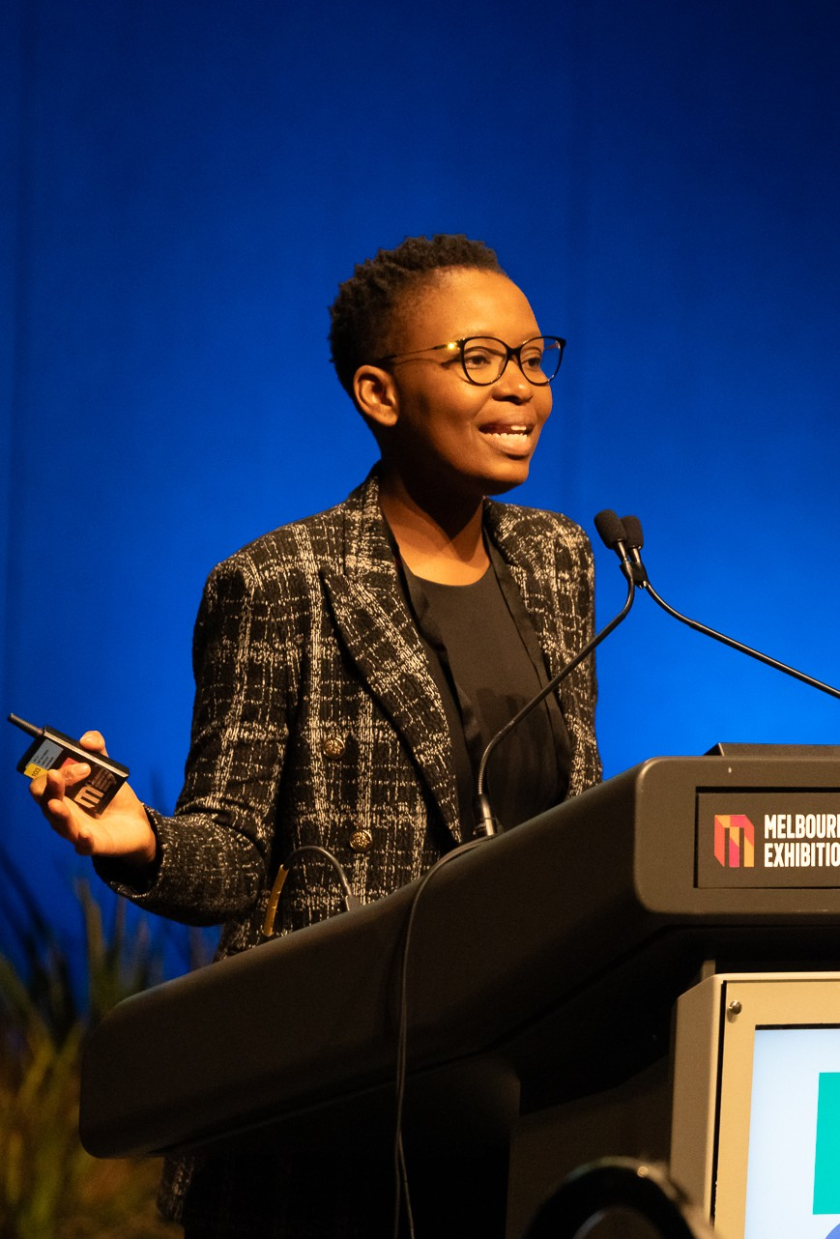 Woman speaking at conference podium
