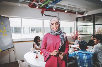 Mature businesswoman with hijab in teamwork in office