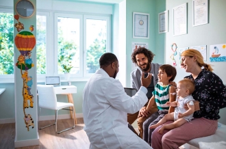 Close up of a young family at a Pediatrician's Office